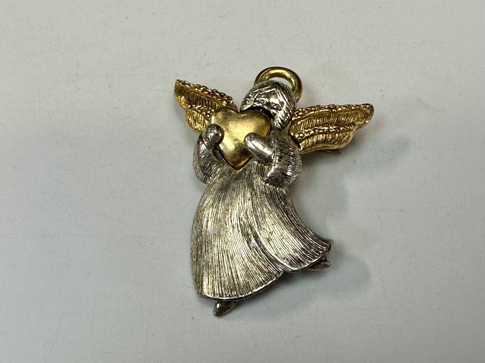 Angle holding heart -vintage two tone LC Liz Claiborne Signed Brooch Pin
