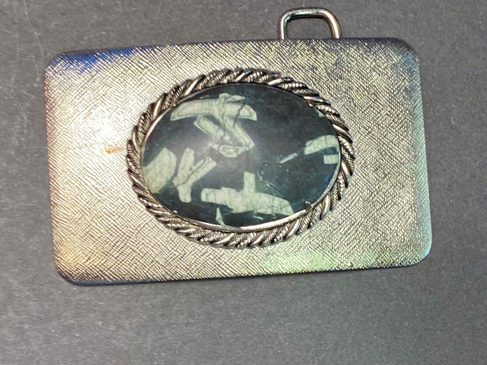 Black & white Oval Cabochon Conch centerpiece on Western belt buckle