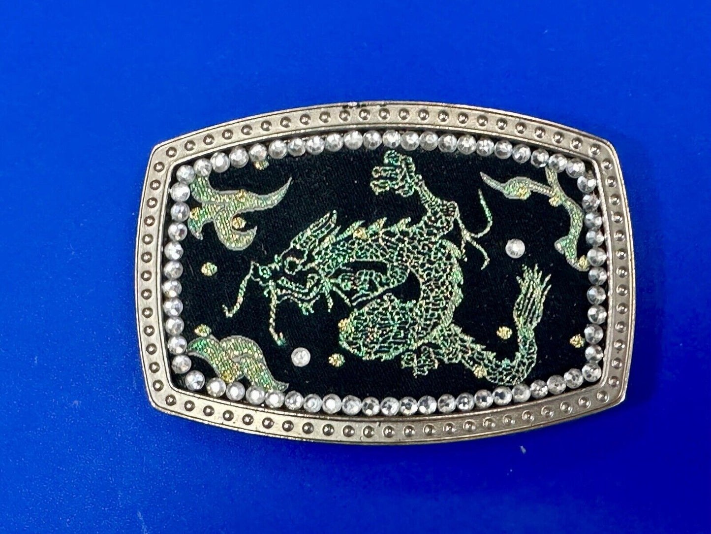 Chinese Dragon pattern symbol on silver tone rhinestone accented belt buckle
