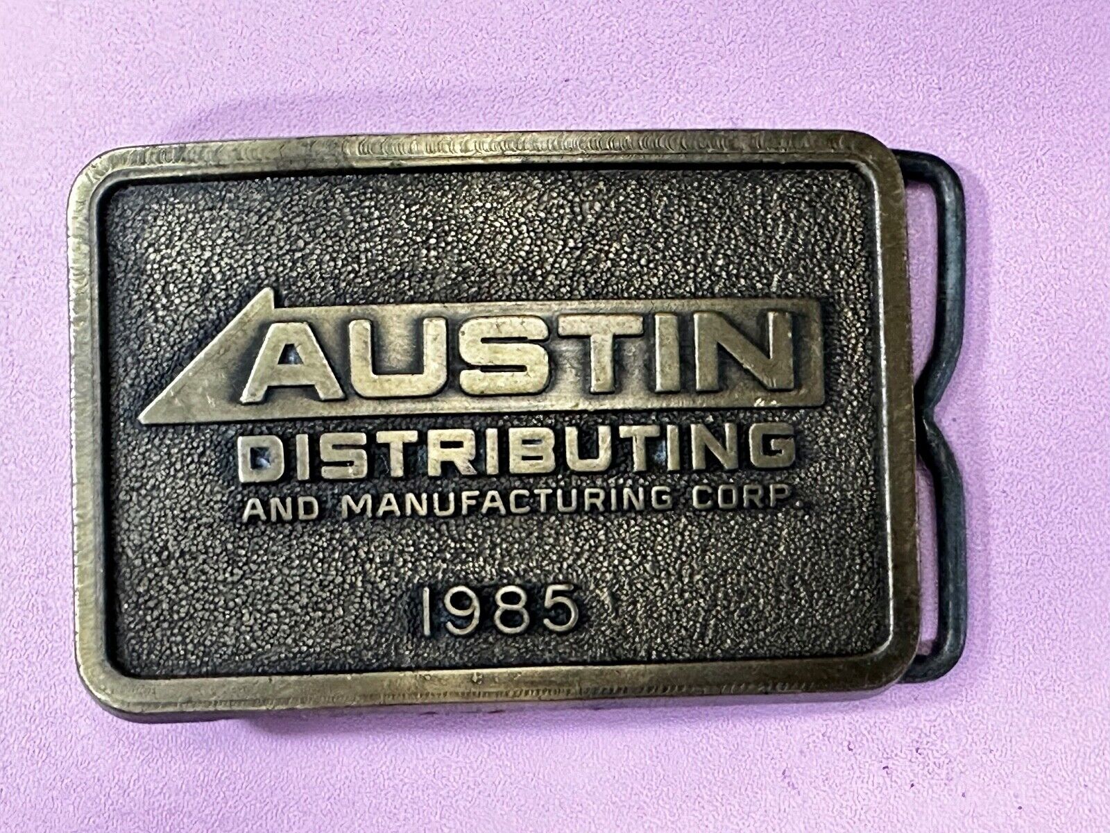 Austin Texas Distributing and Manufacturing 1985 Advertisement Promo Belt Buckle