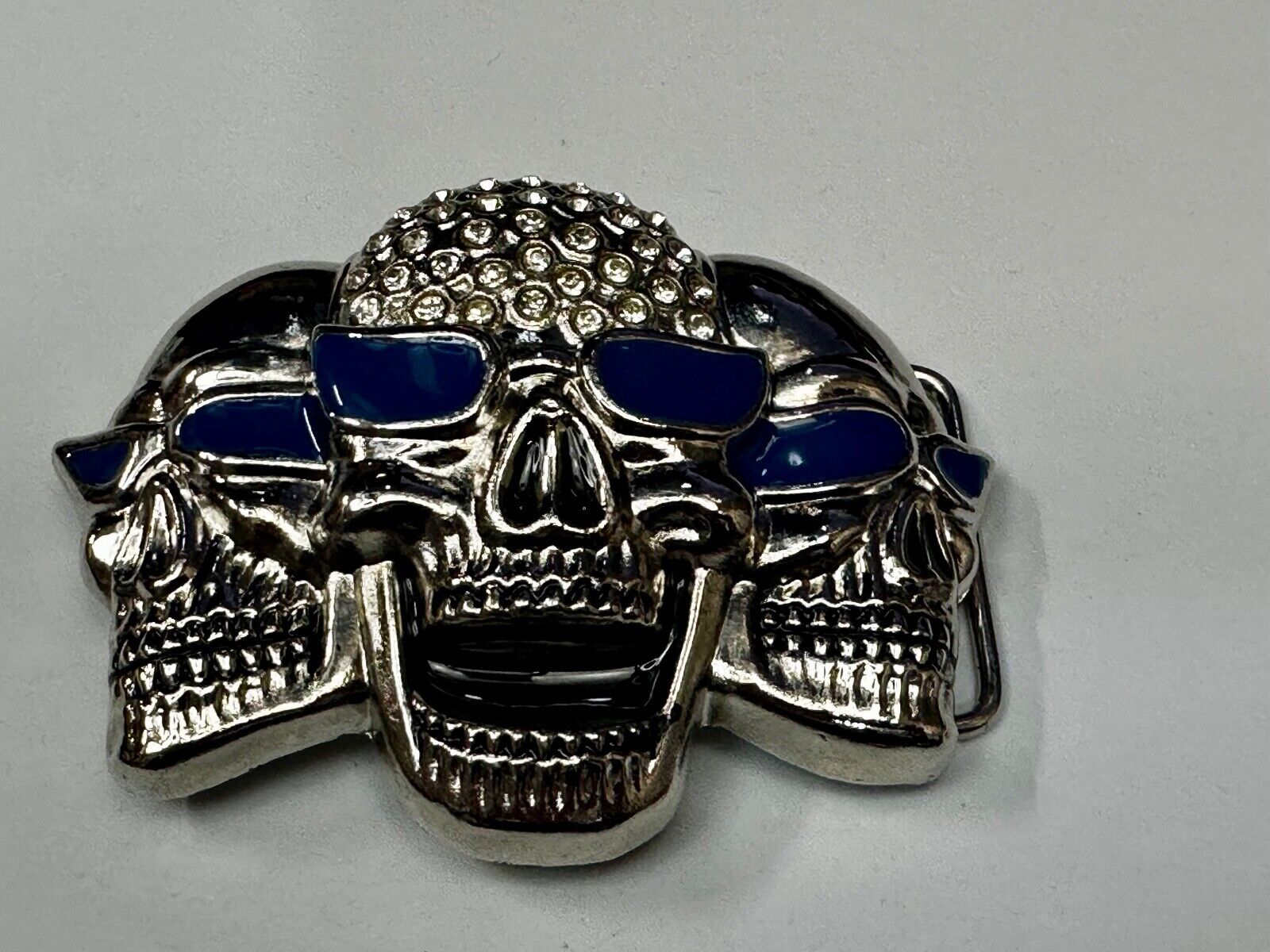 Three Skull's Heads Rhinestone Accented W/ Blue Shades Silver Tone Belt Buckle