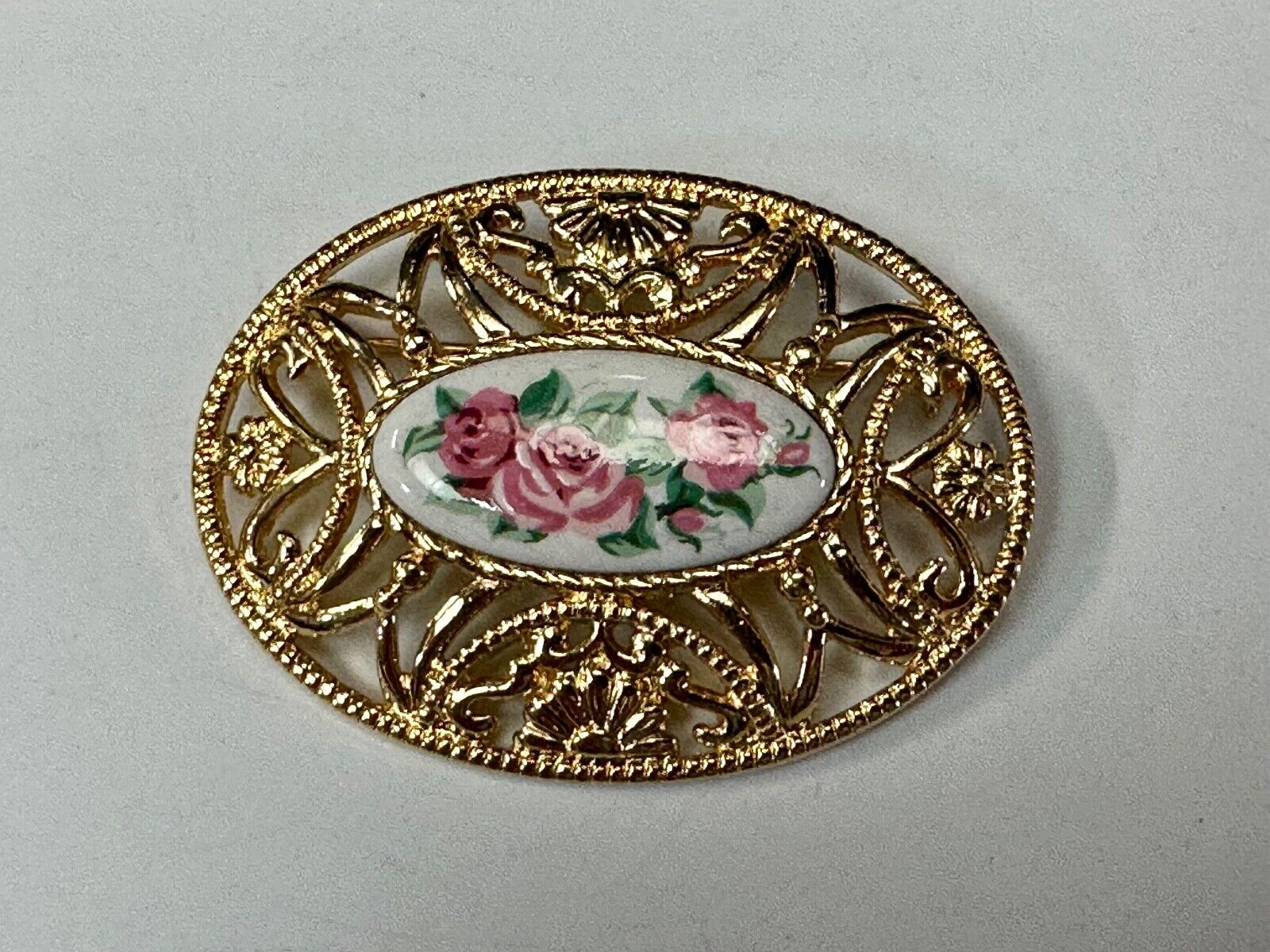 Avon signed gold tone see through surround Porcelain flower theme brooch pin