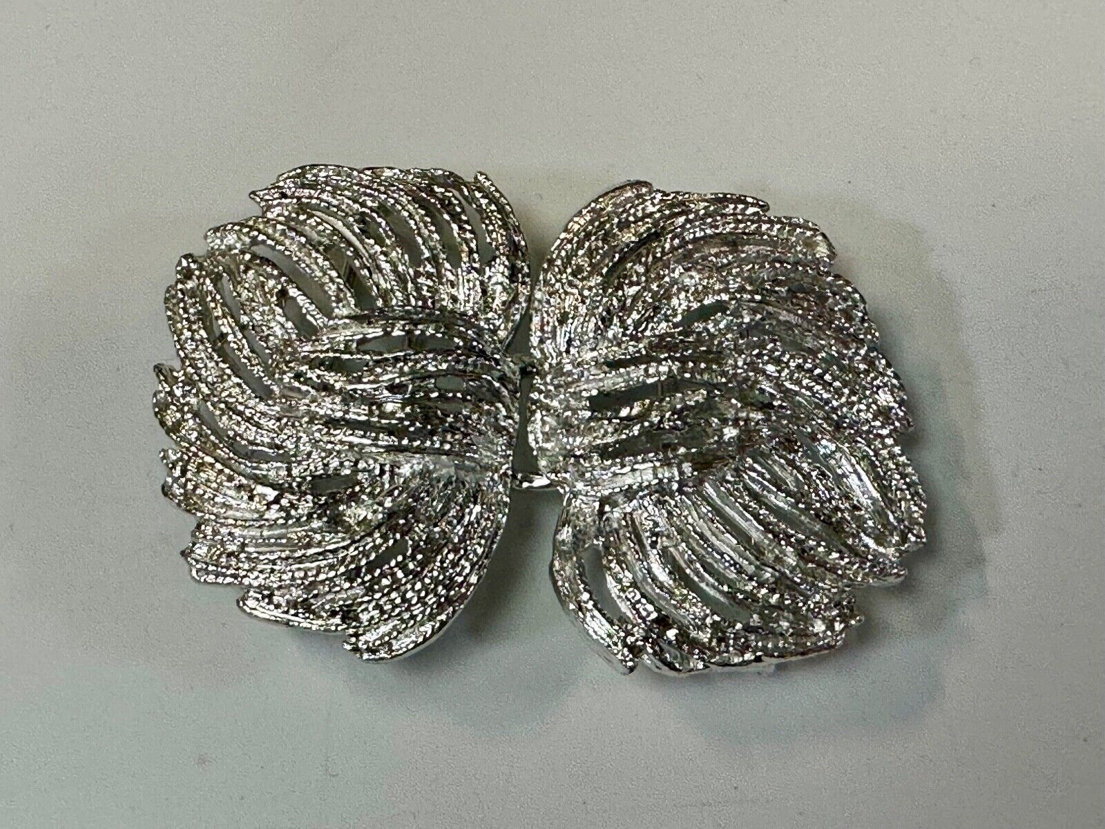 Two piece interlocking sea leaf brushed pattern see through pattern belt buckle