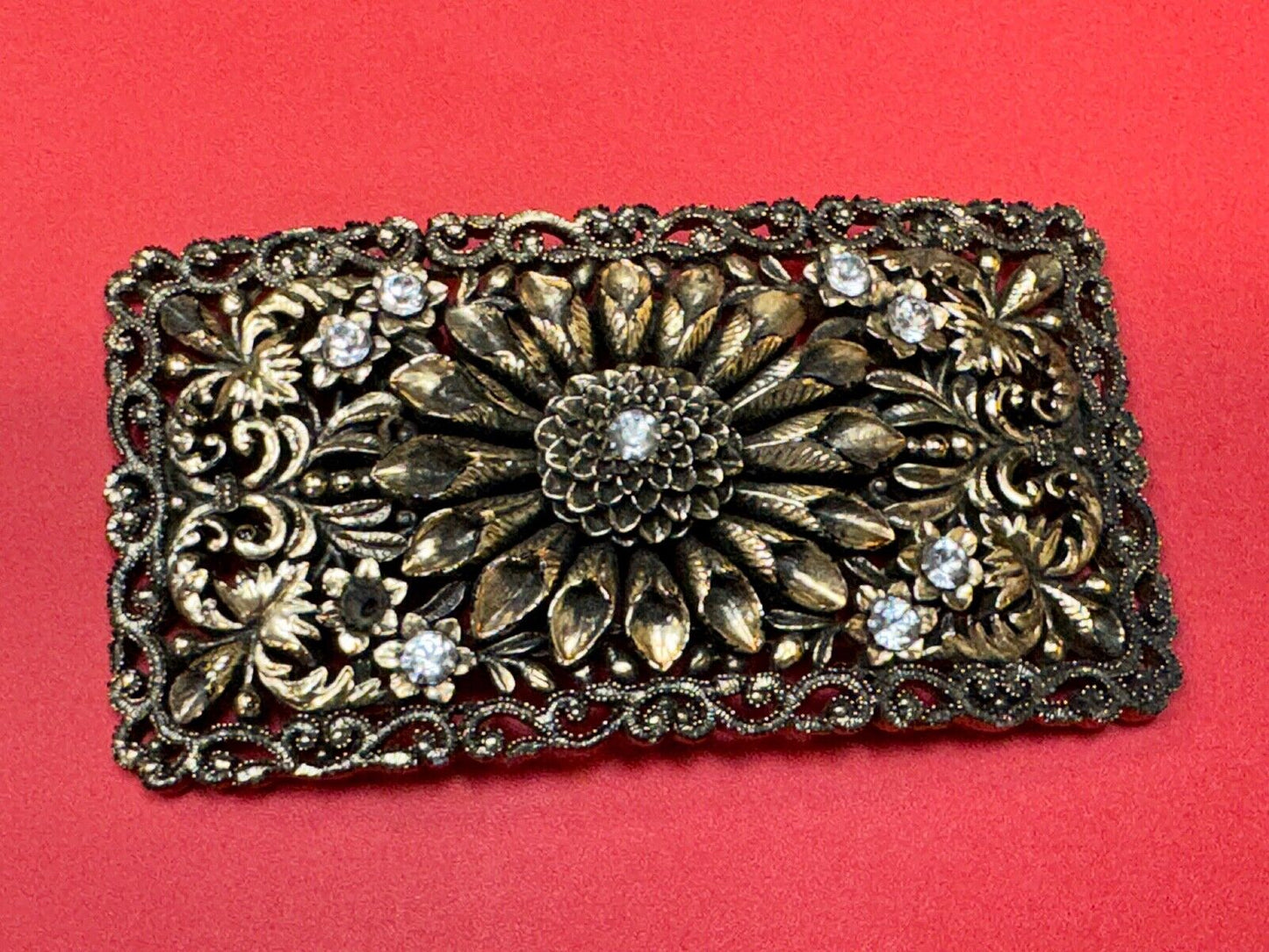 Antique gold tone? Flower theme Rhinestone covered scarf slide belt loupe buckle