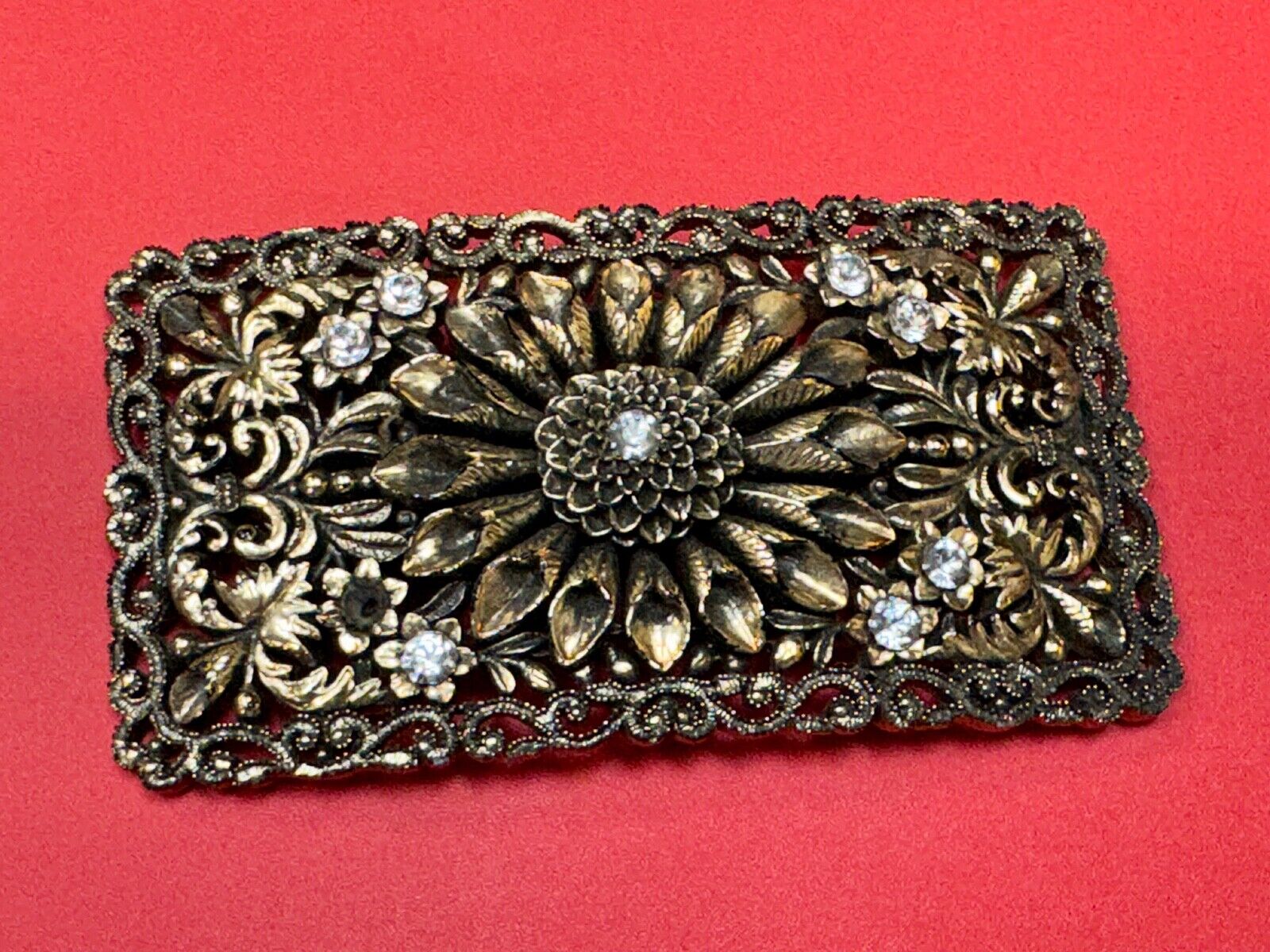 Antique gold tone? Flower theme Rhinestone covered scarf slide belt loupe buckle