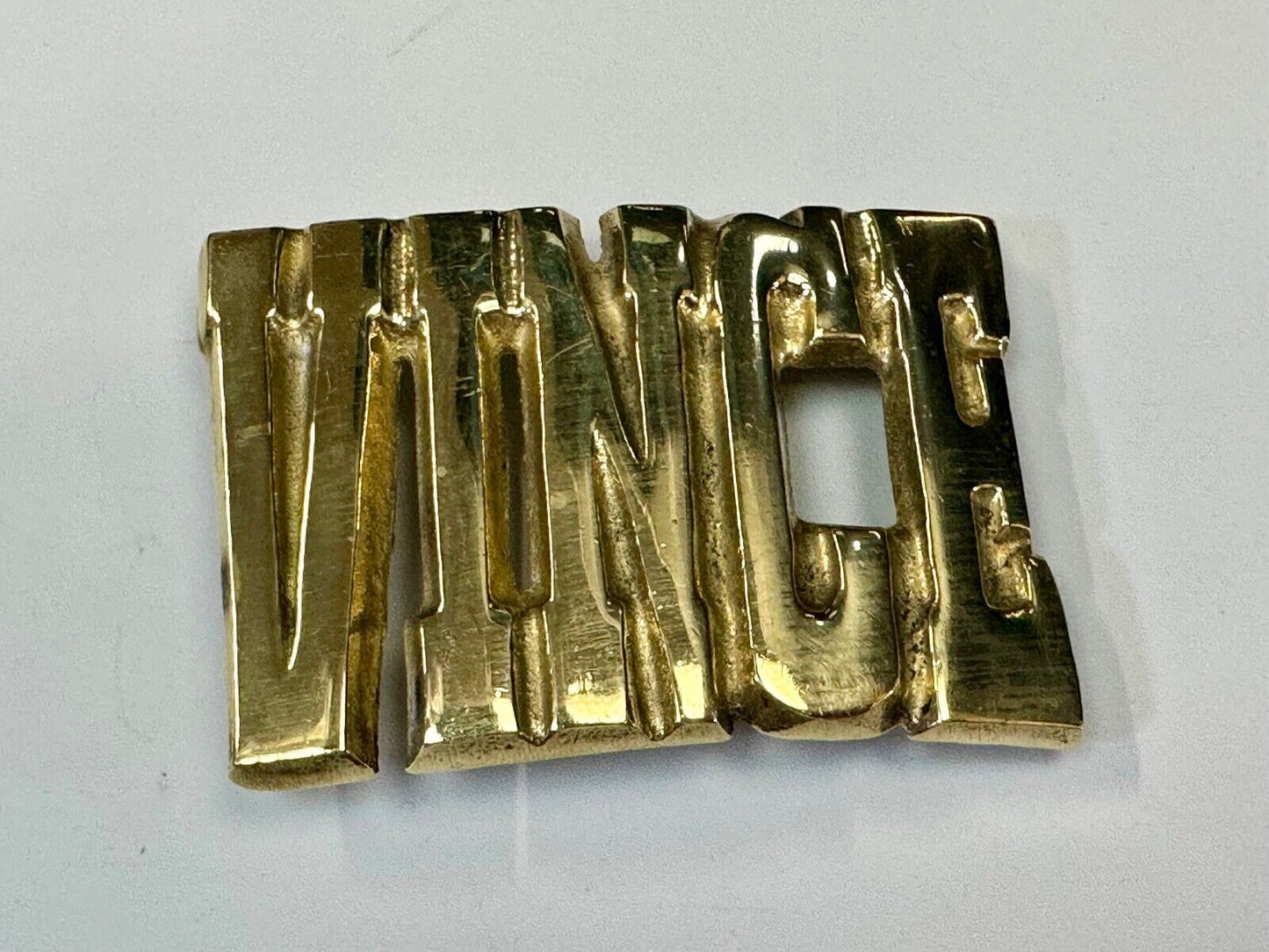 Vince,  Cutout block letters solid brass Vintage belt buckle marked Taiwan ROC