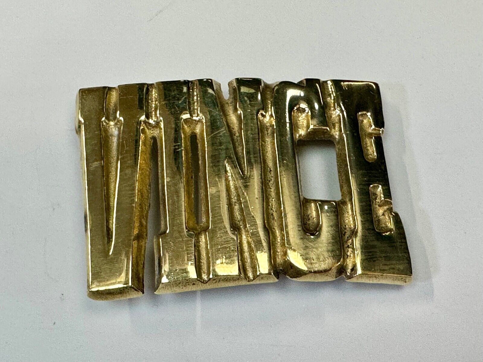 Vince,  Cutout block letters solid brass Vintage belt buckle marked Taiwan ROC