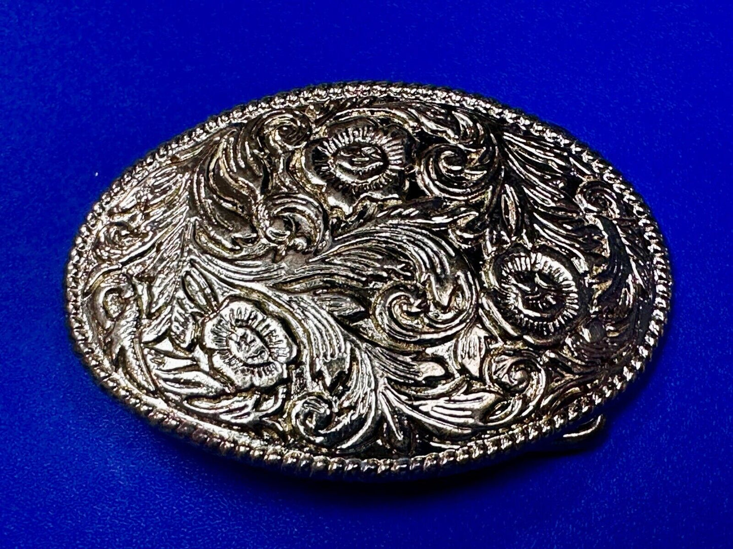 Vintage gold tone western flower swirl design belt buckle
