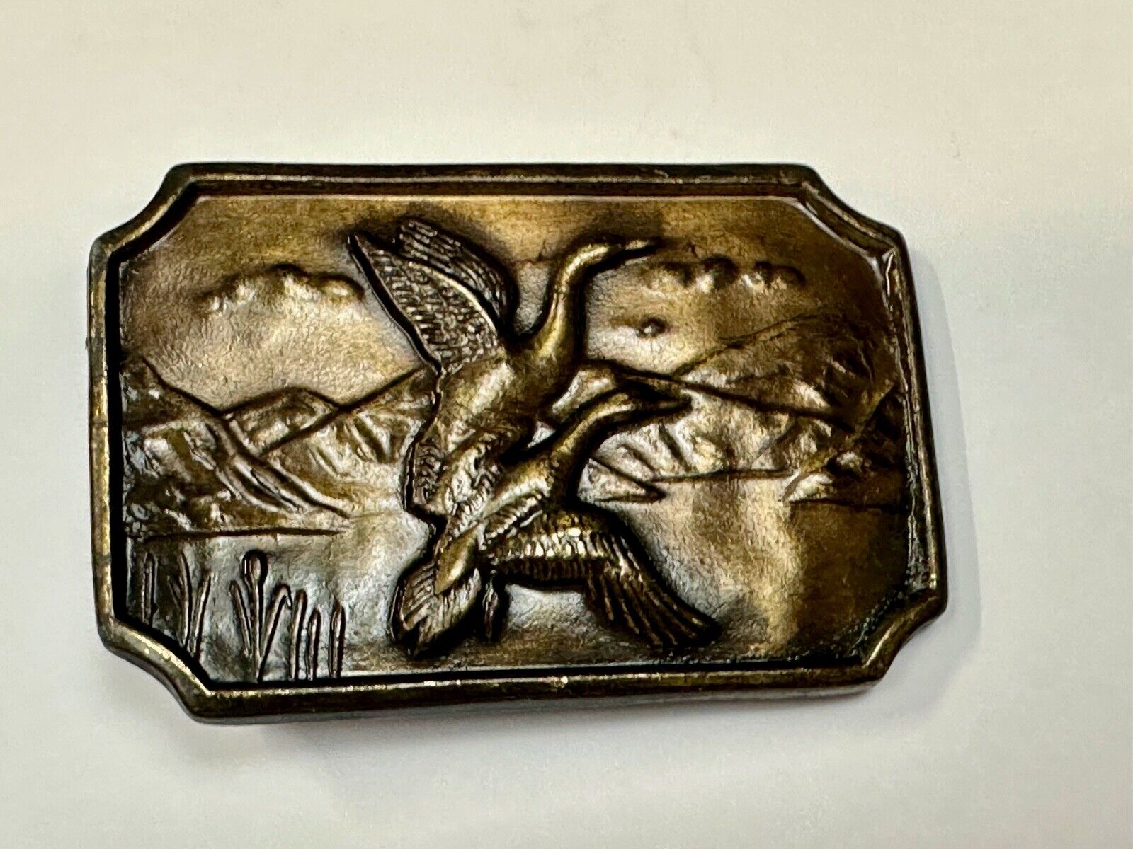 Two ducks flying from pond - Vintage nature scene belt buckle