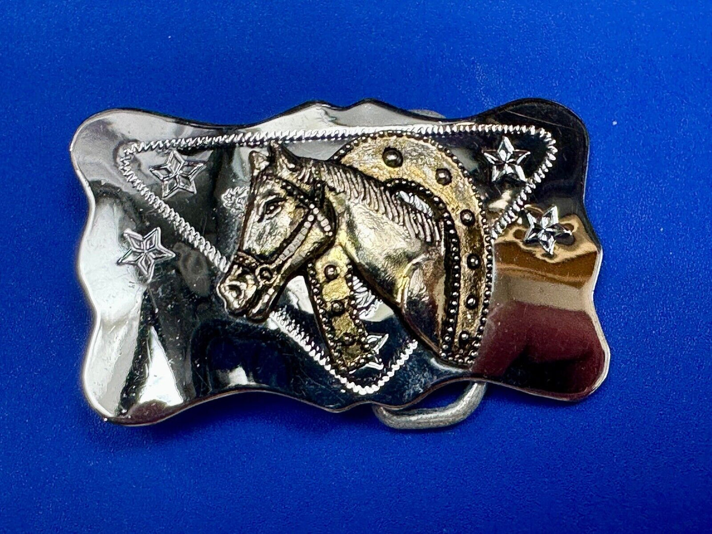Vintage horse head through lucky horseshoe on reflective western belt buckle
