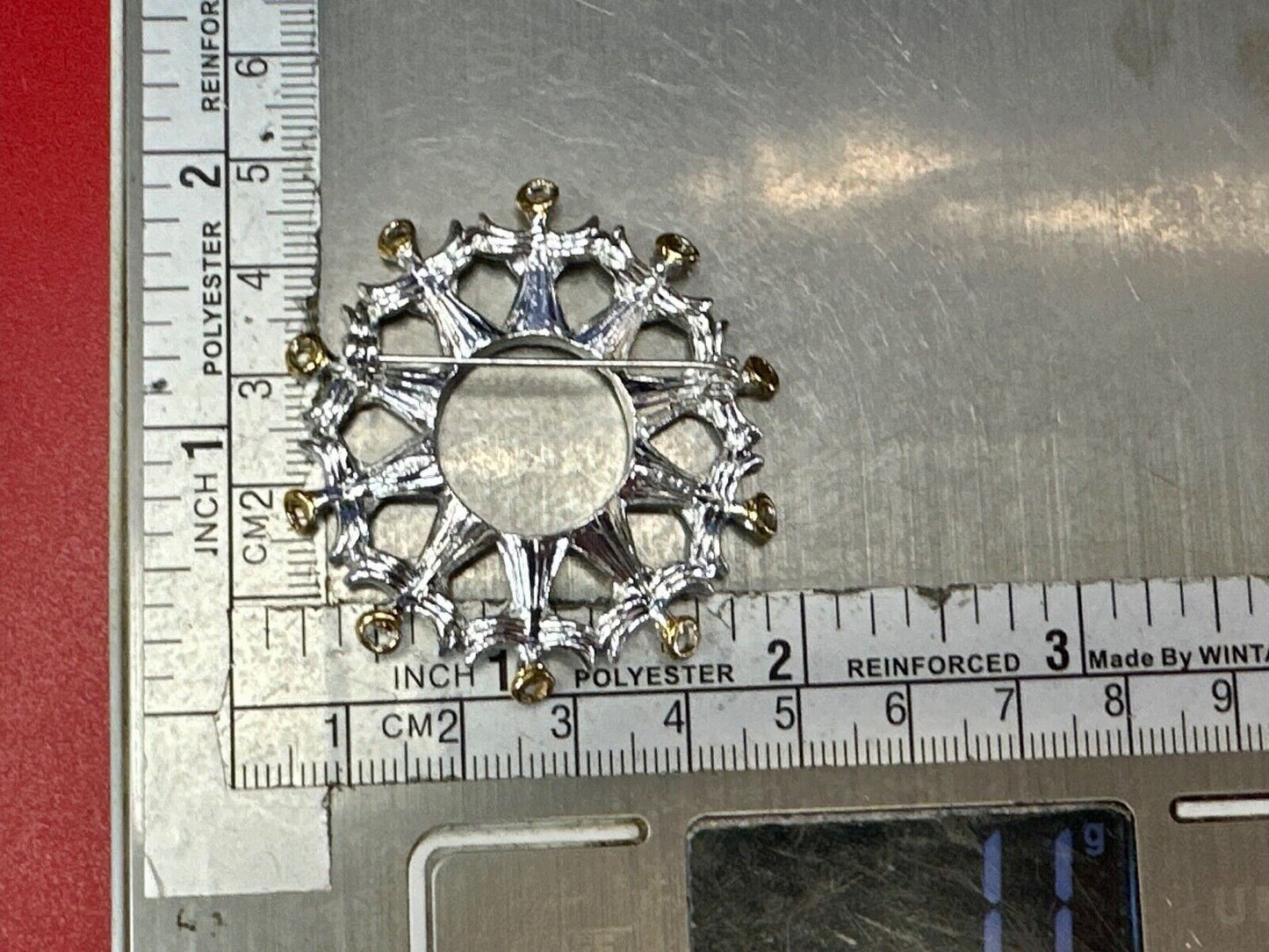 Angles in Circular pattern holiday wreath Avon signed vintage brooch pin