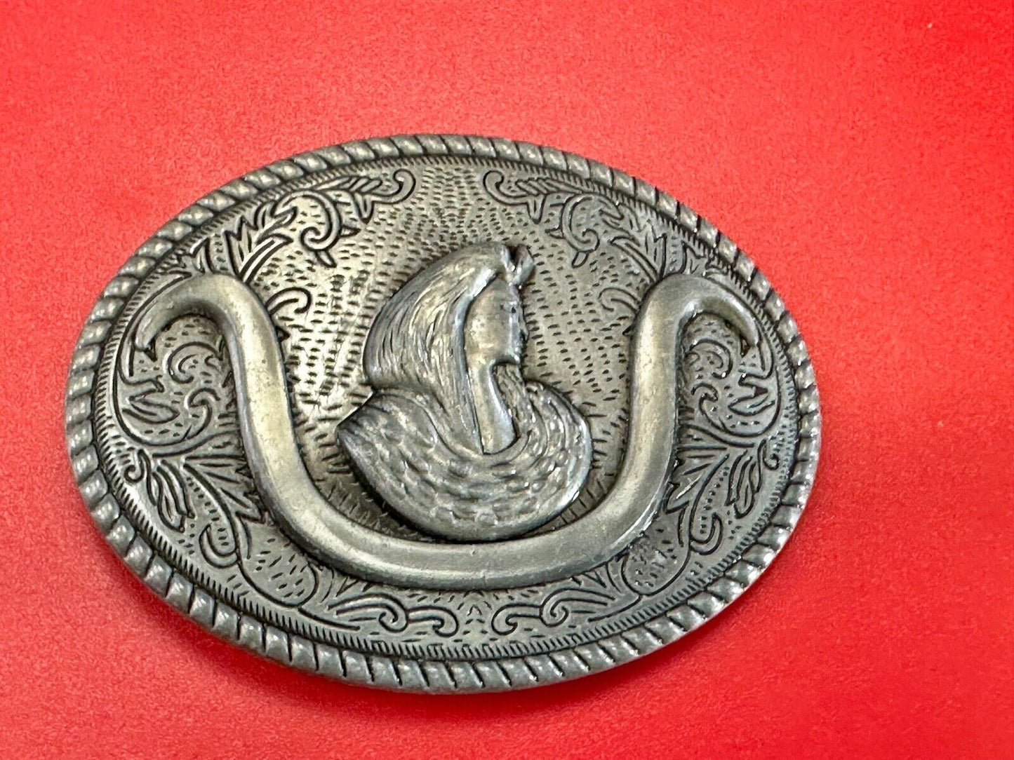 unknown to me!   Man with long hair - longhorn wester belt buckle