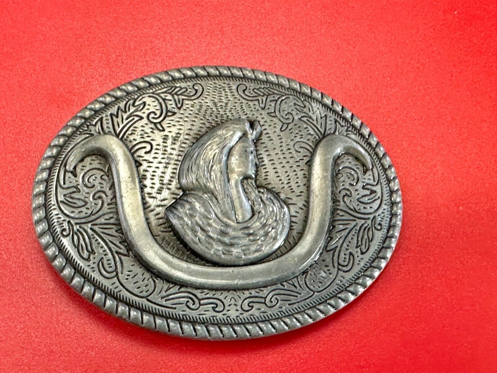 unknown to me!   Man with long hair - longhorn wester belt buckle