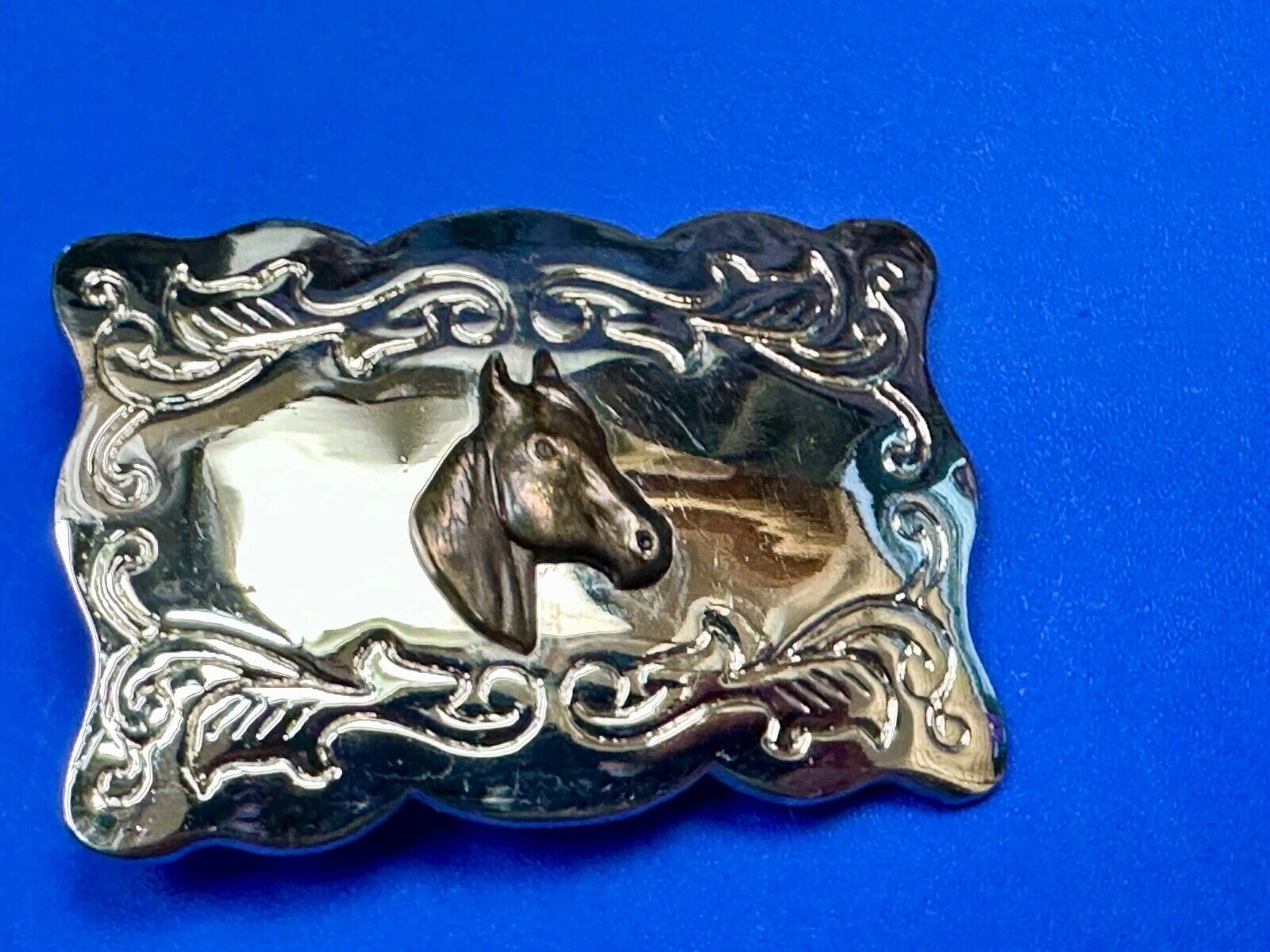 Vintage horse head centered on western rectangular two tone belt buckle