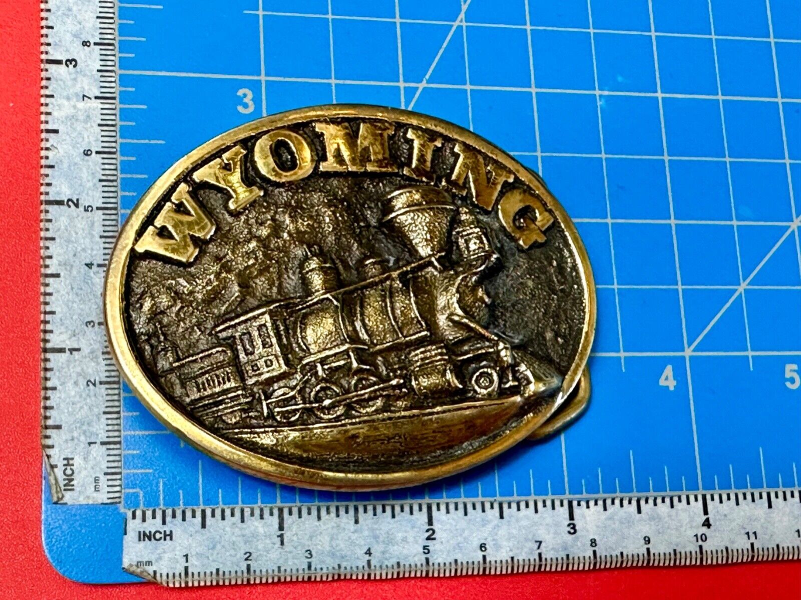 The great state of Wyoming Train History brass belt buckle by Heritage Mint LTD