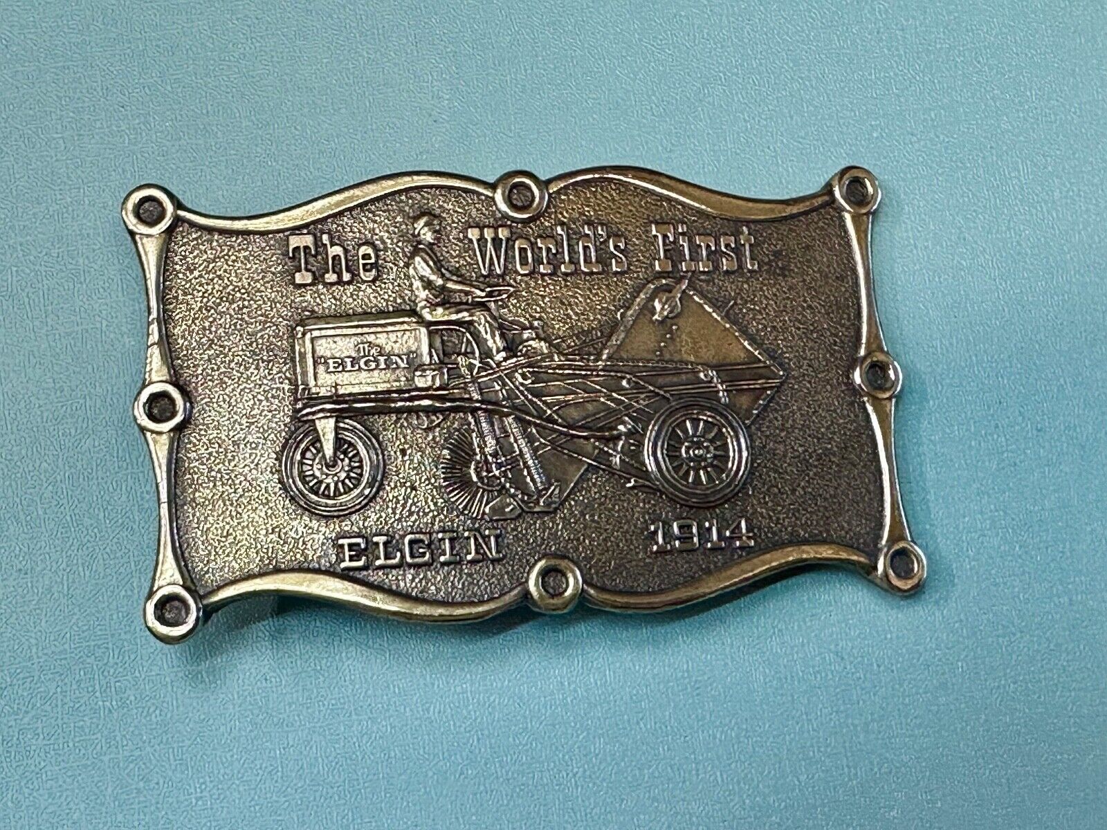 The Elgin, The worlds first tree sweeper commemorative belt buckle by Lewis