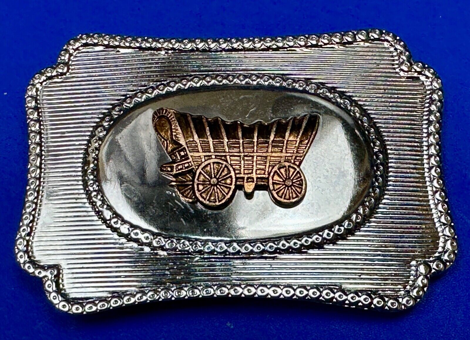 Vintage covered wagon western horse drawn transportation belt buckle