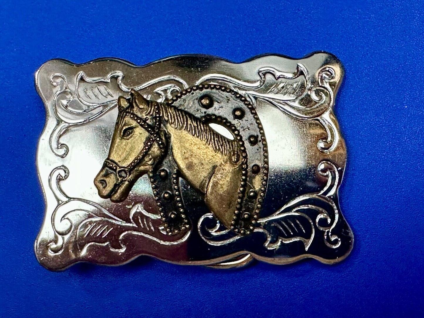 Vintage lucky horseshoe with head centerpiece on western two tone belt buckle