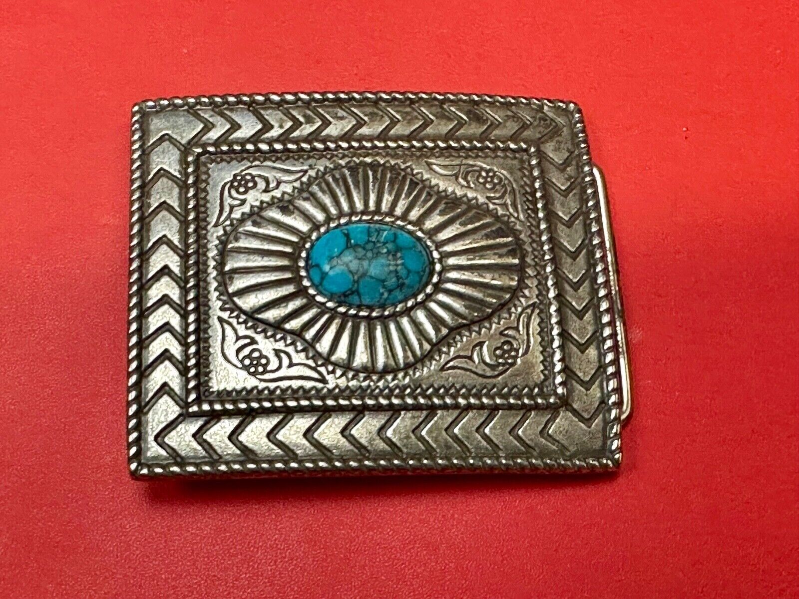 Turquoise Cab centerpiece on southwestern pattern silver tone belt buckle