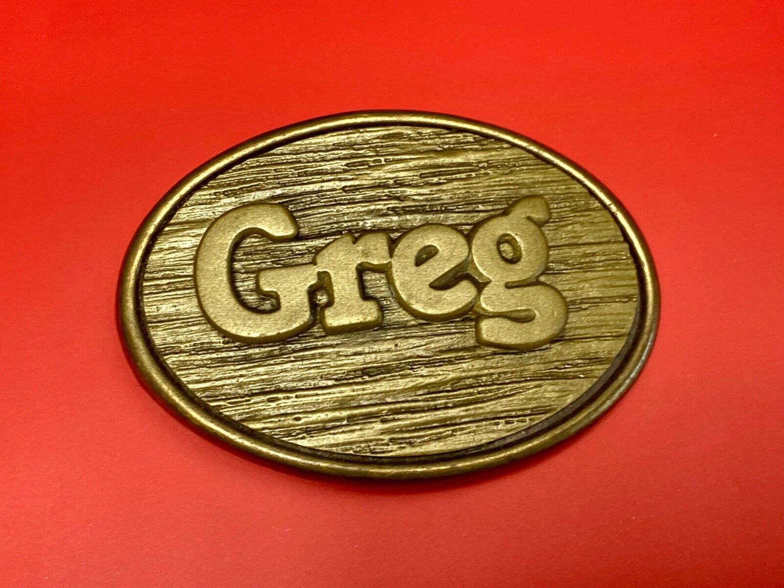 Vintage GREG name metal wood grain western Belt Buckle By Oden - Made In USA