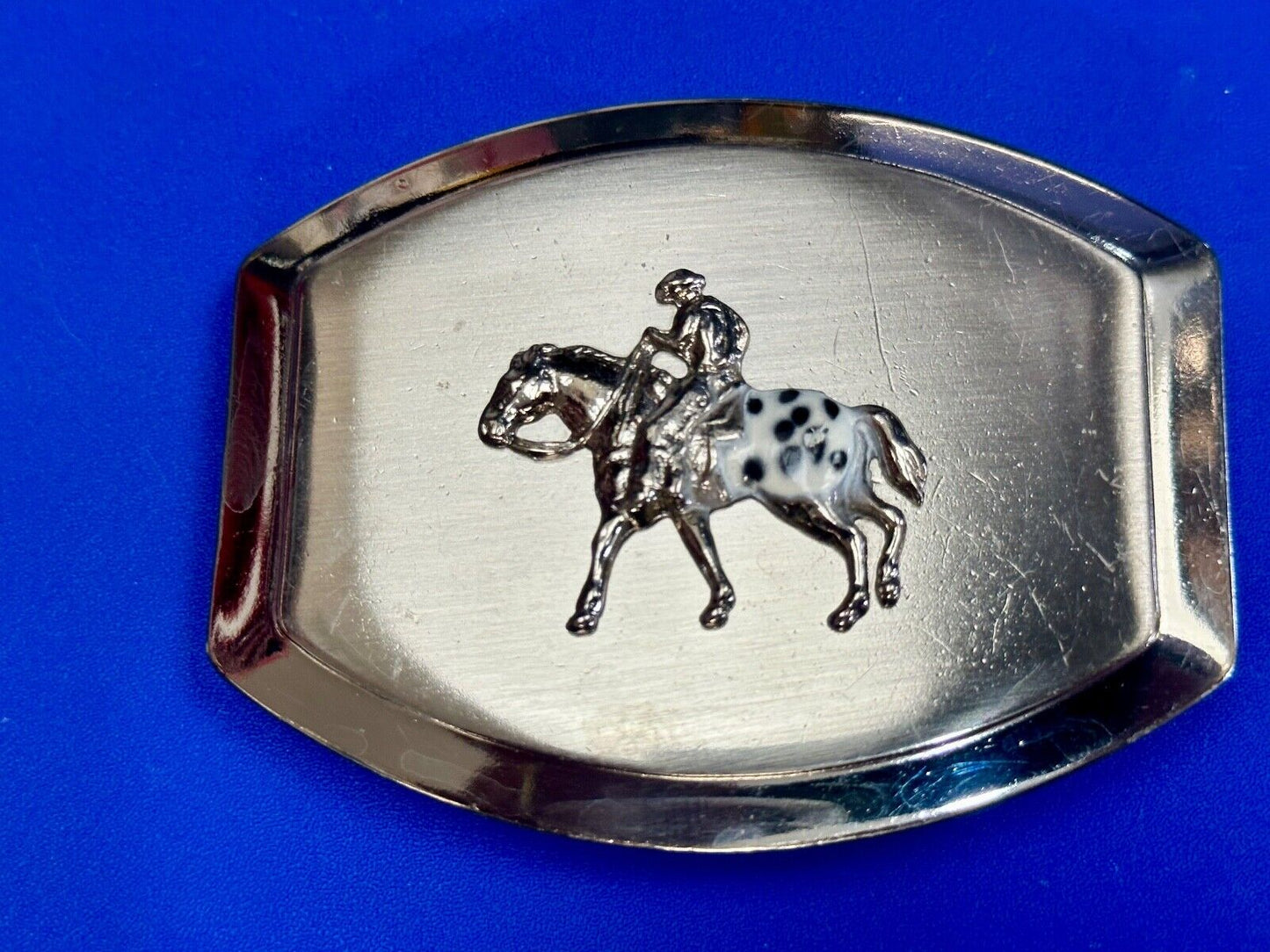 Vintage Horseback Riders cowboys belt buckle with black & white enamel accents
