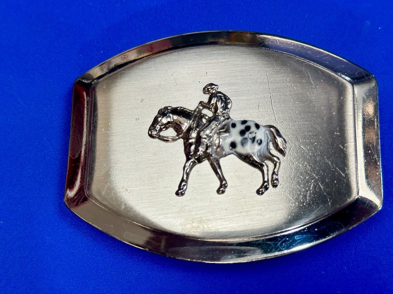 Vintage Horseback Riders cowboys belt buckle with black & white enamel accents