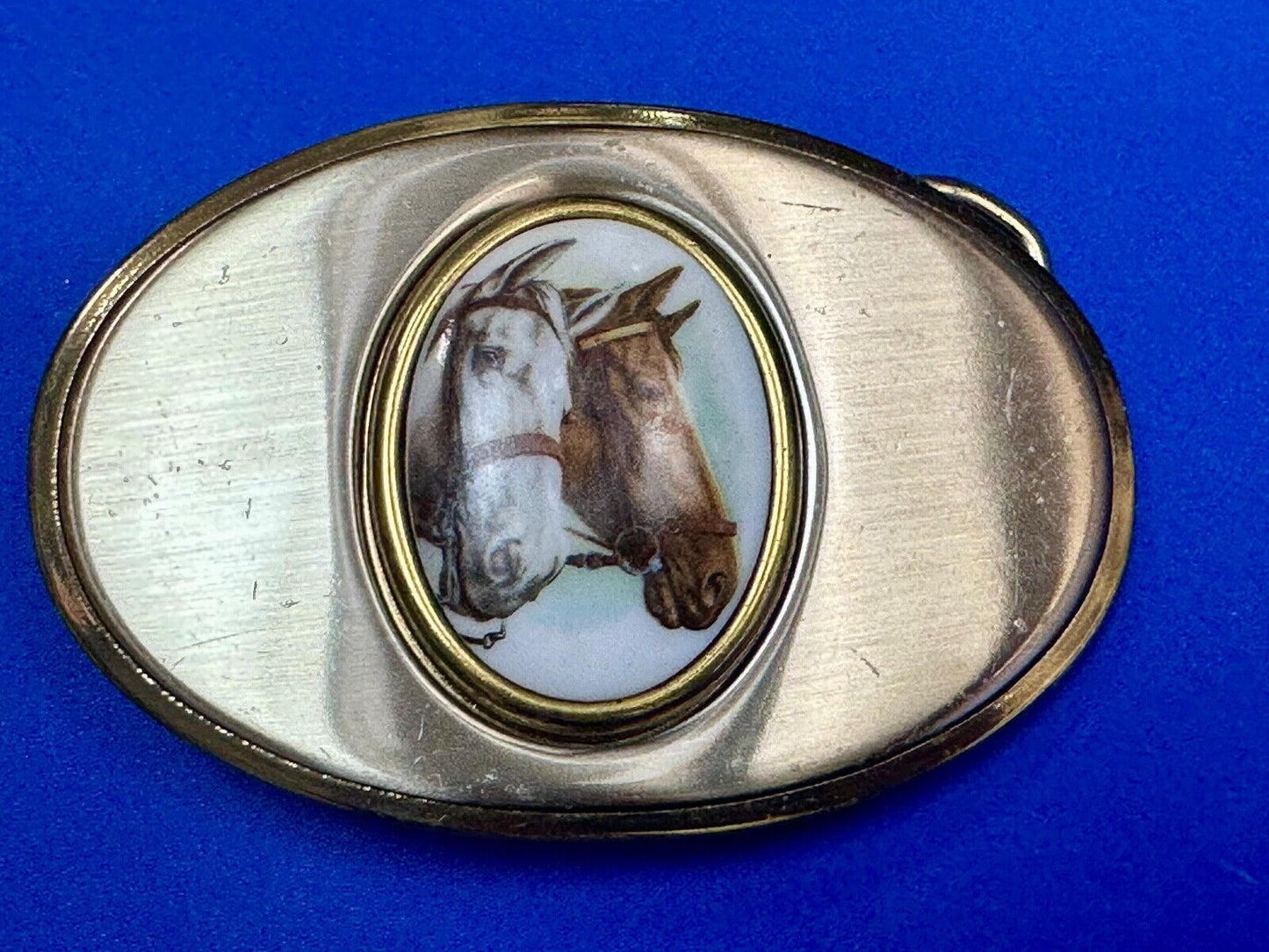 Two horse head picture in oval smooth gold tone Vintage Belt Buckle