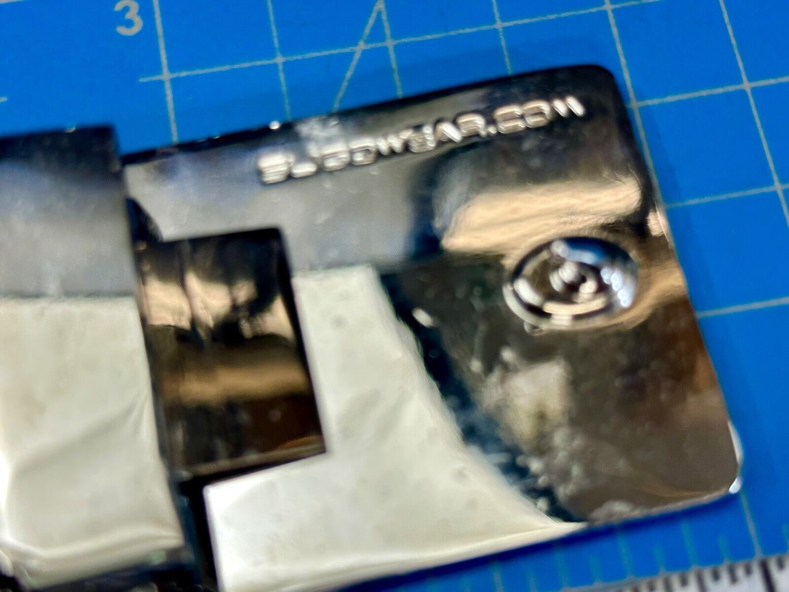 unknown to me!   Sligo Sugowear blue colored emblem or logo belt buckle