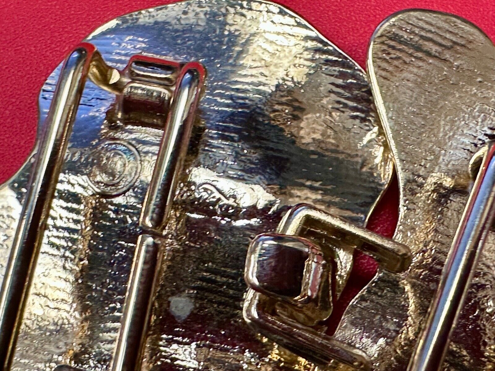 Two-piece interlocking gold tone leaf swirl theme belt slide buckle signed _____