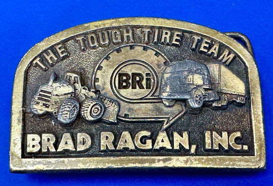 The Tough Tire Team BRi Brad Ragan, Inc. vintage belt buckle by Spec-Cast