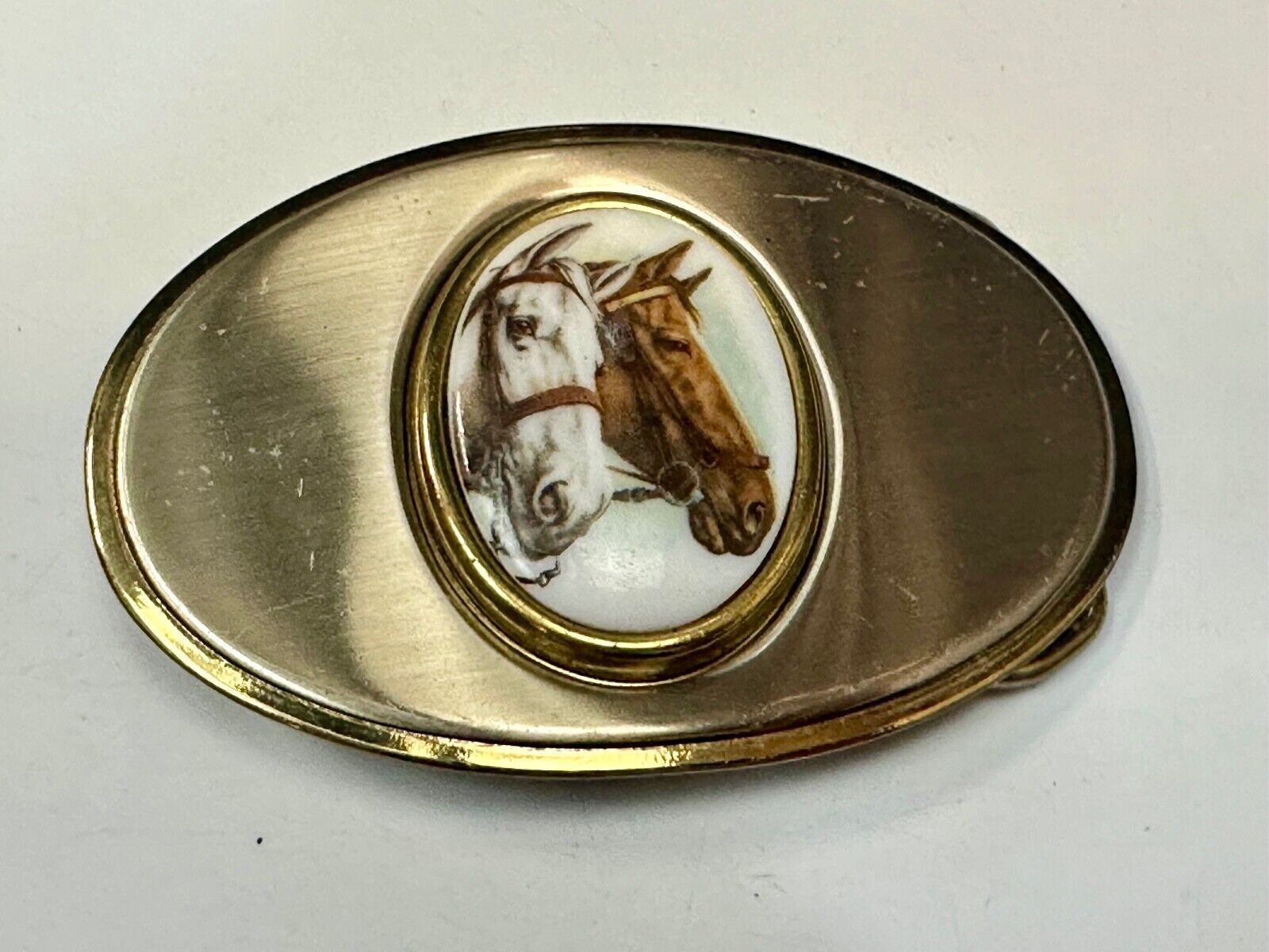 Two horse head picture in oval smooth gold tone Vintage Belt Buckle