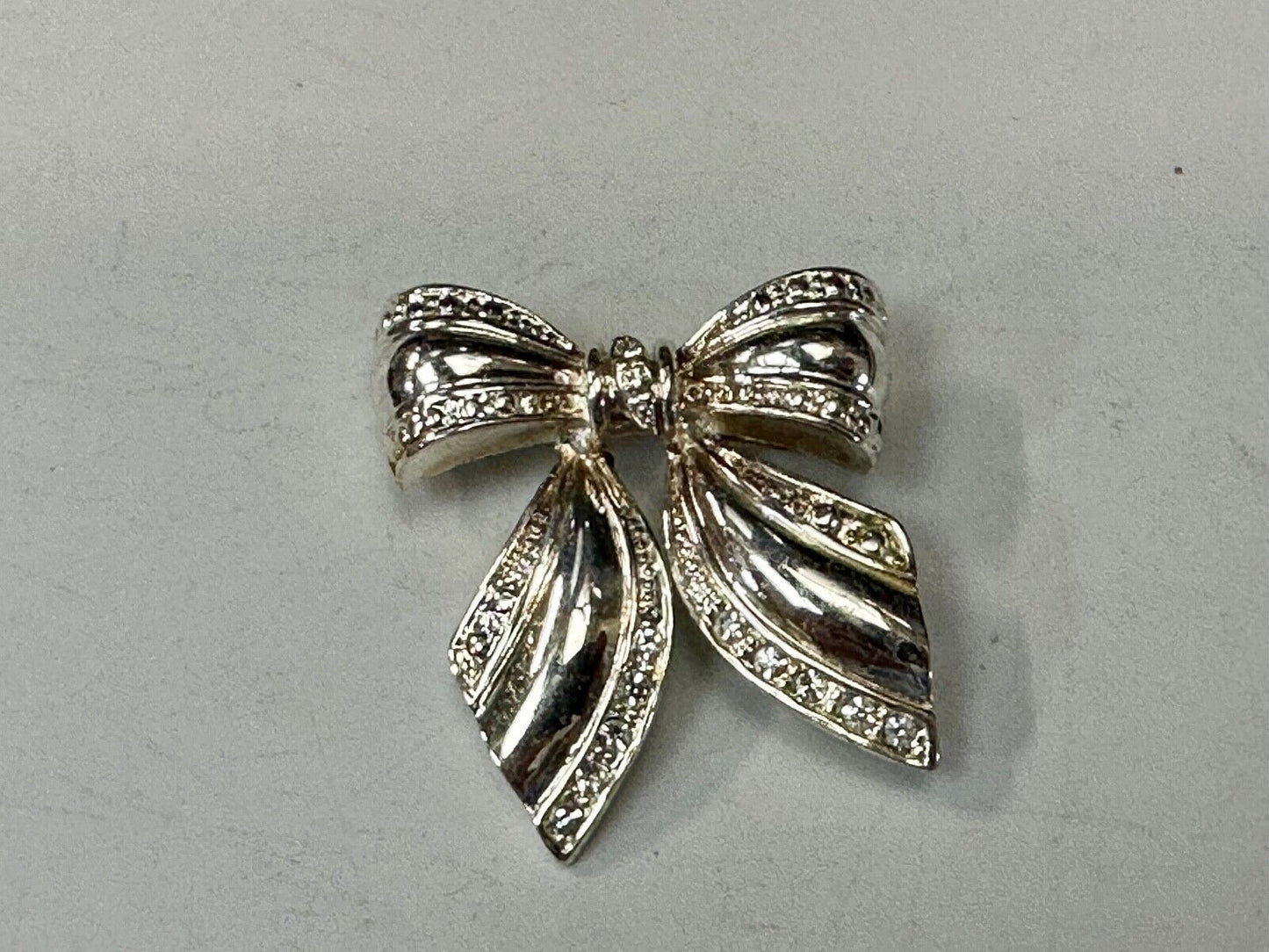 AAI Signed Vintage Brooch Pin 1.5” Bow Crystal Rhinestones Silver Tone