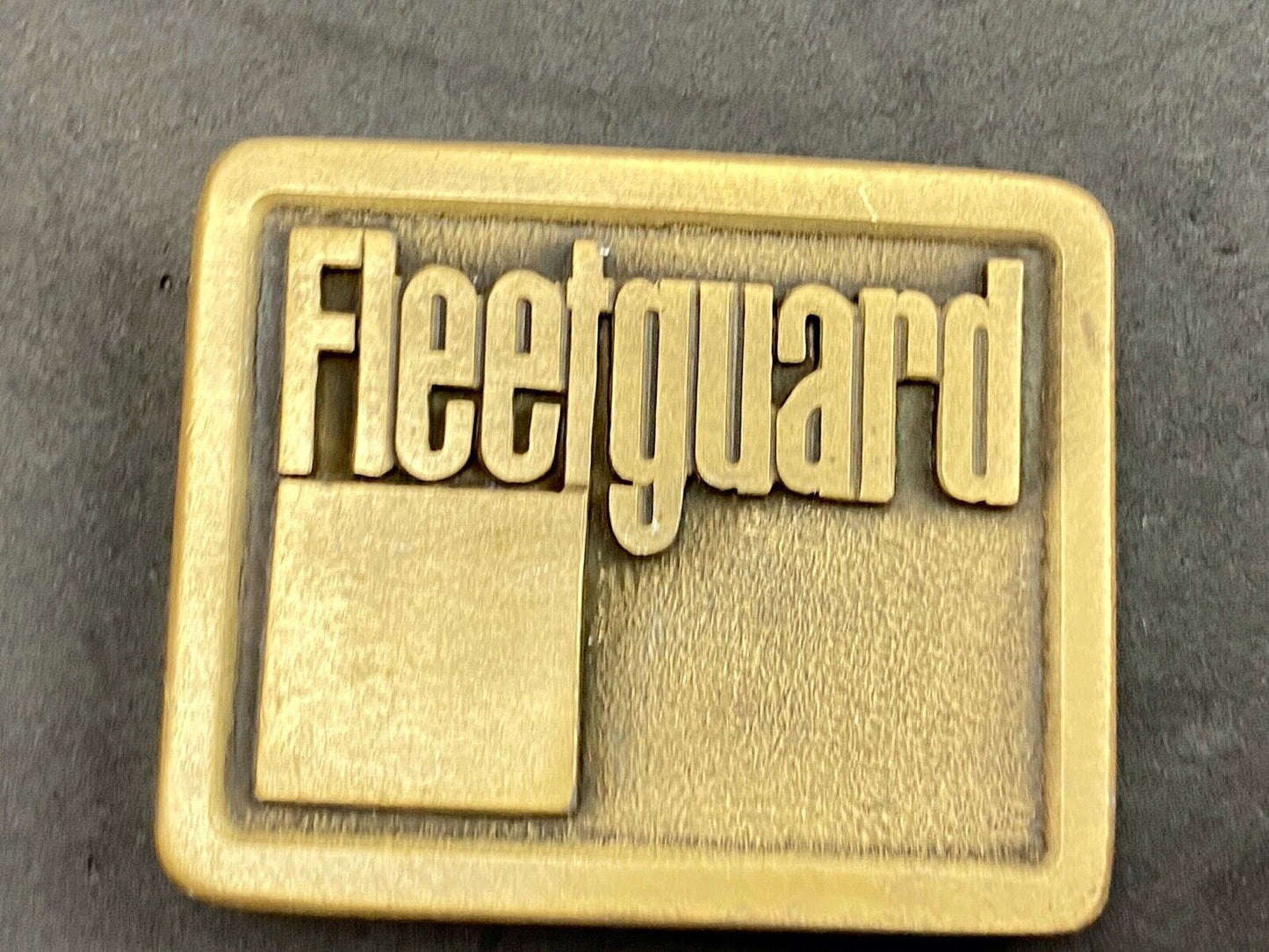 Vintage Fleetguard Construction Equipment Company Advertising Belt Buckle 