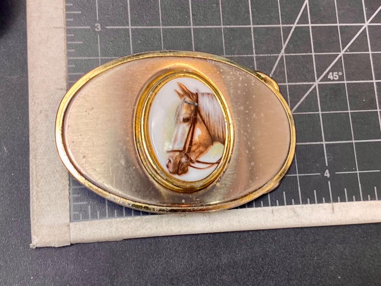 Vintage horse head picture centered in western belt buckle