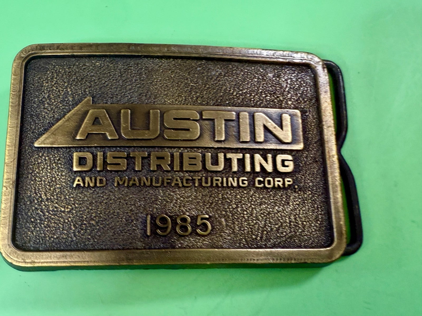 Austin Texas Distributing and Manufacturing Corp 1985 NOS RJ Belt Buckle