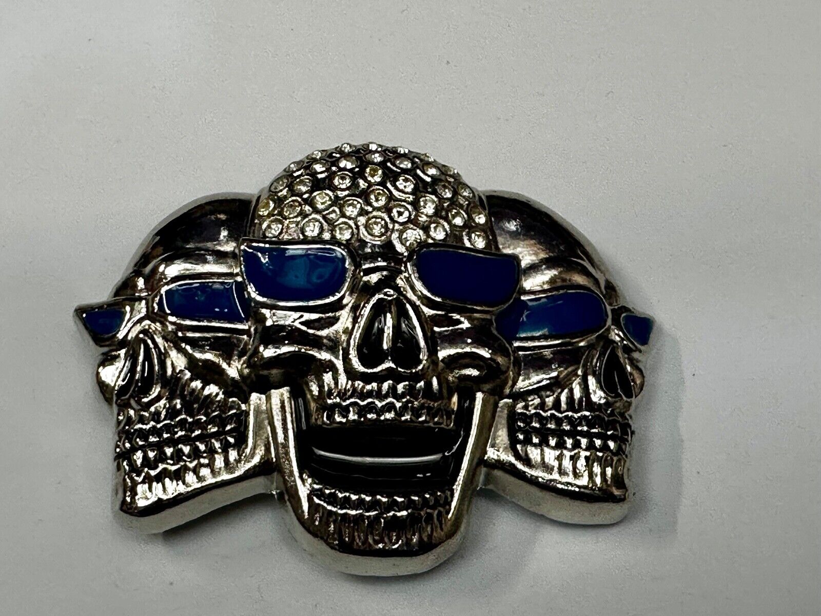 Three Skull's Heads Rhinestone Accented W/ Blue Shades Silver Tone Belt Buckle
