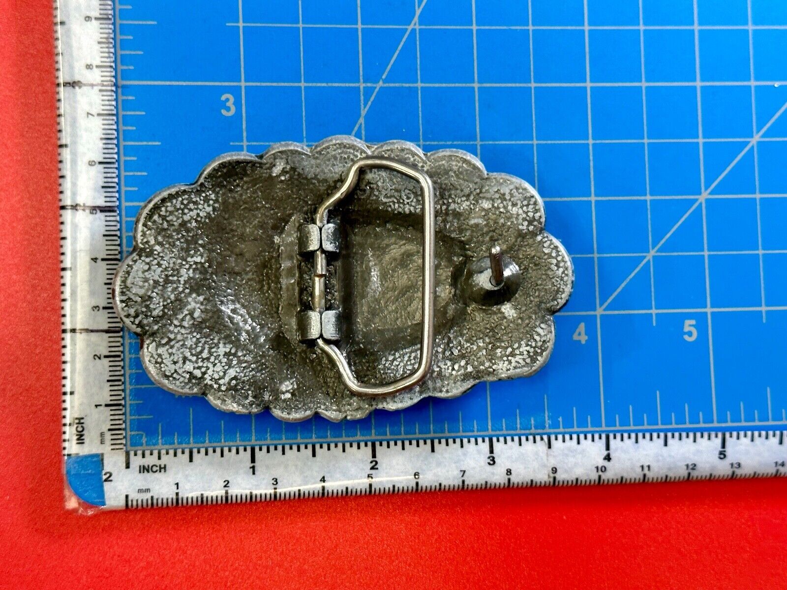 Turquoise stone centered on Vintage metal flower theme belt buckle