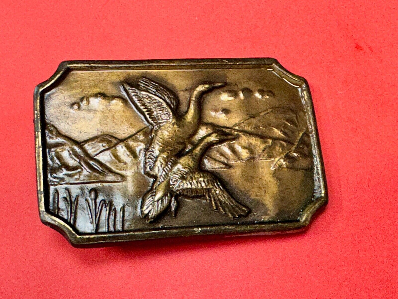 Two ducks flying from pond - Vintage nature scene belt buckle