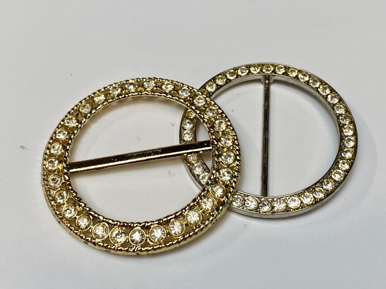 Two piece lot of antique Rhinestone covered round scarf slides