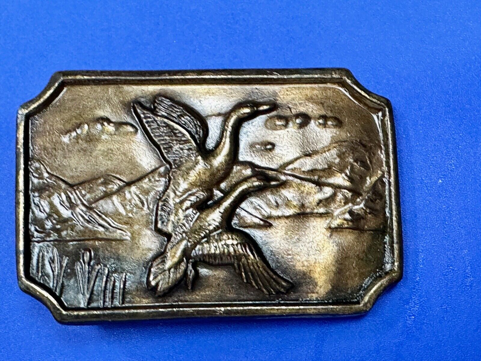 Two ducks flying from pond - Vintage nature scene belt buckle
