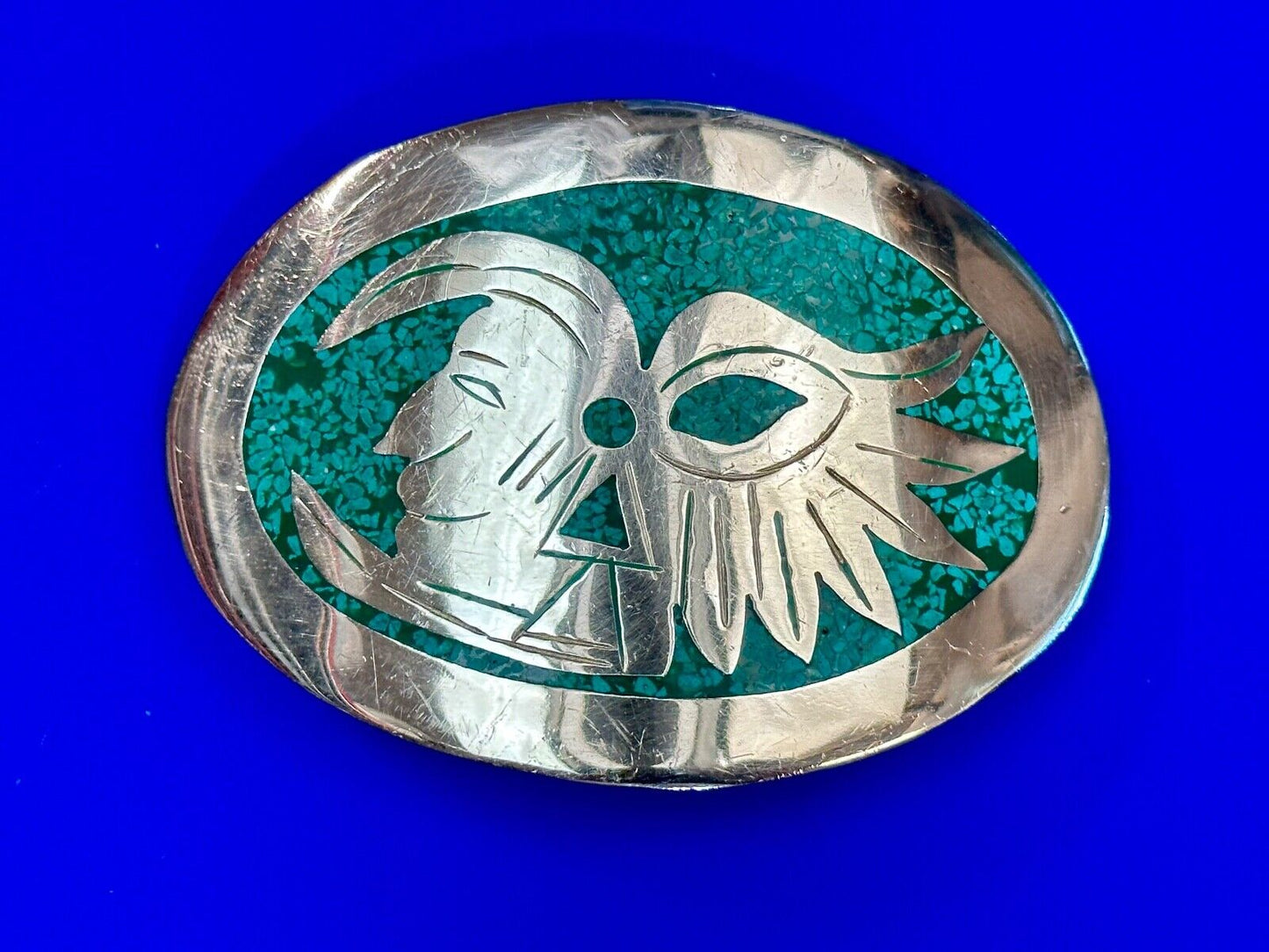 Tribal Face - Inlaid Turquoise chip to Alpaca stamped oval Belt Buckle