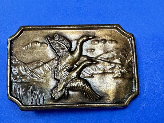 Two ducks flying from pond - Vintage nature scene belt buckle