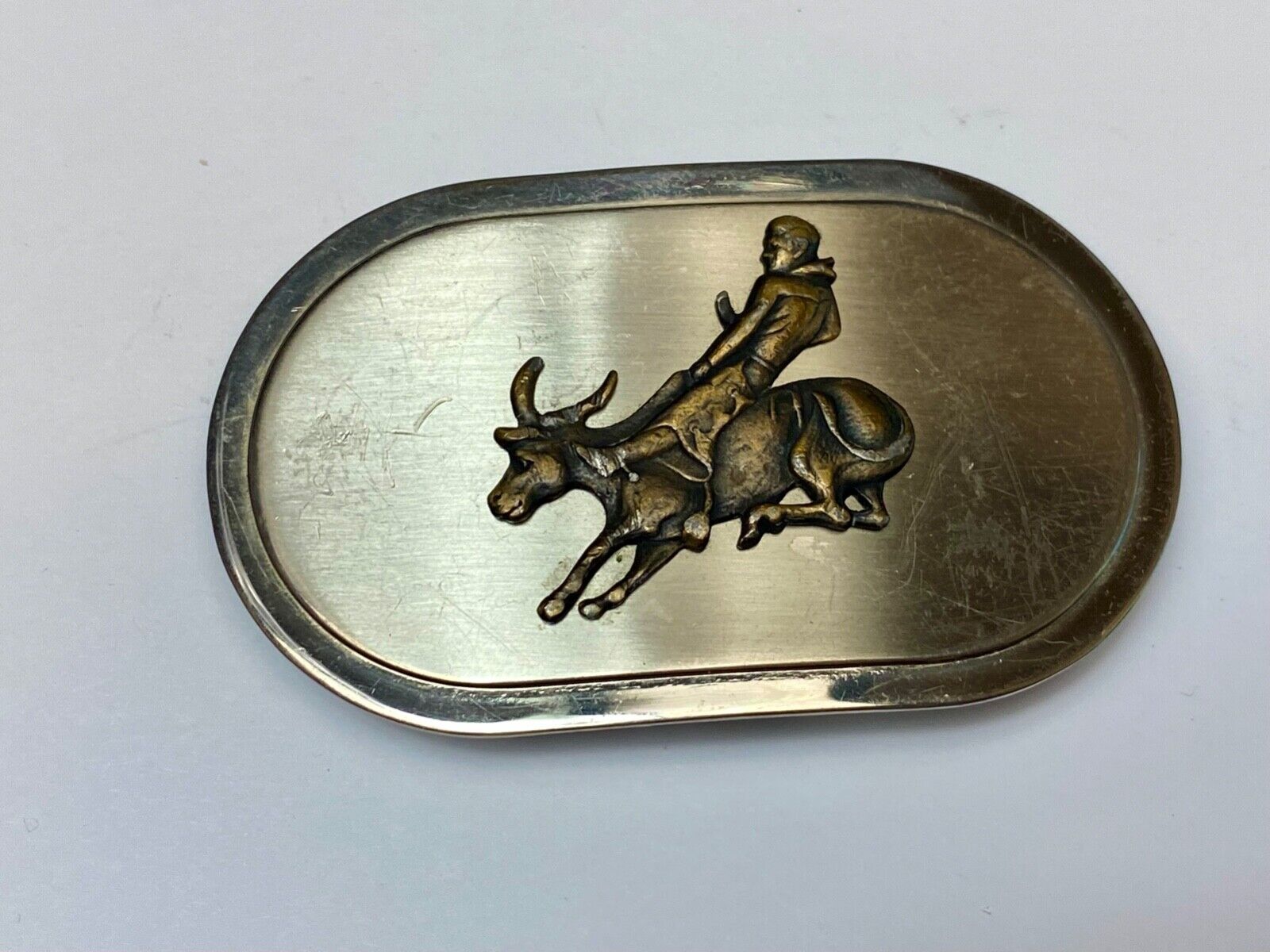Vintage western oval Rodeo Cowboy on bucking bronc? bull numbered belt buckle