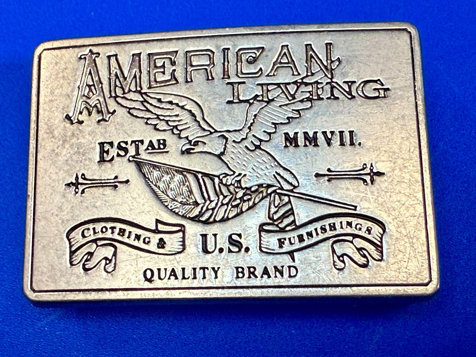 American Living Clothing & Furnishing U.S Quality Brand Promo Belt Buckle