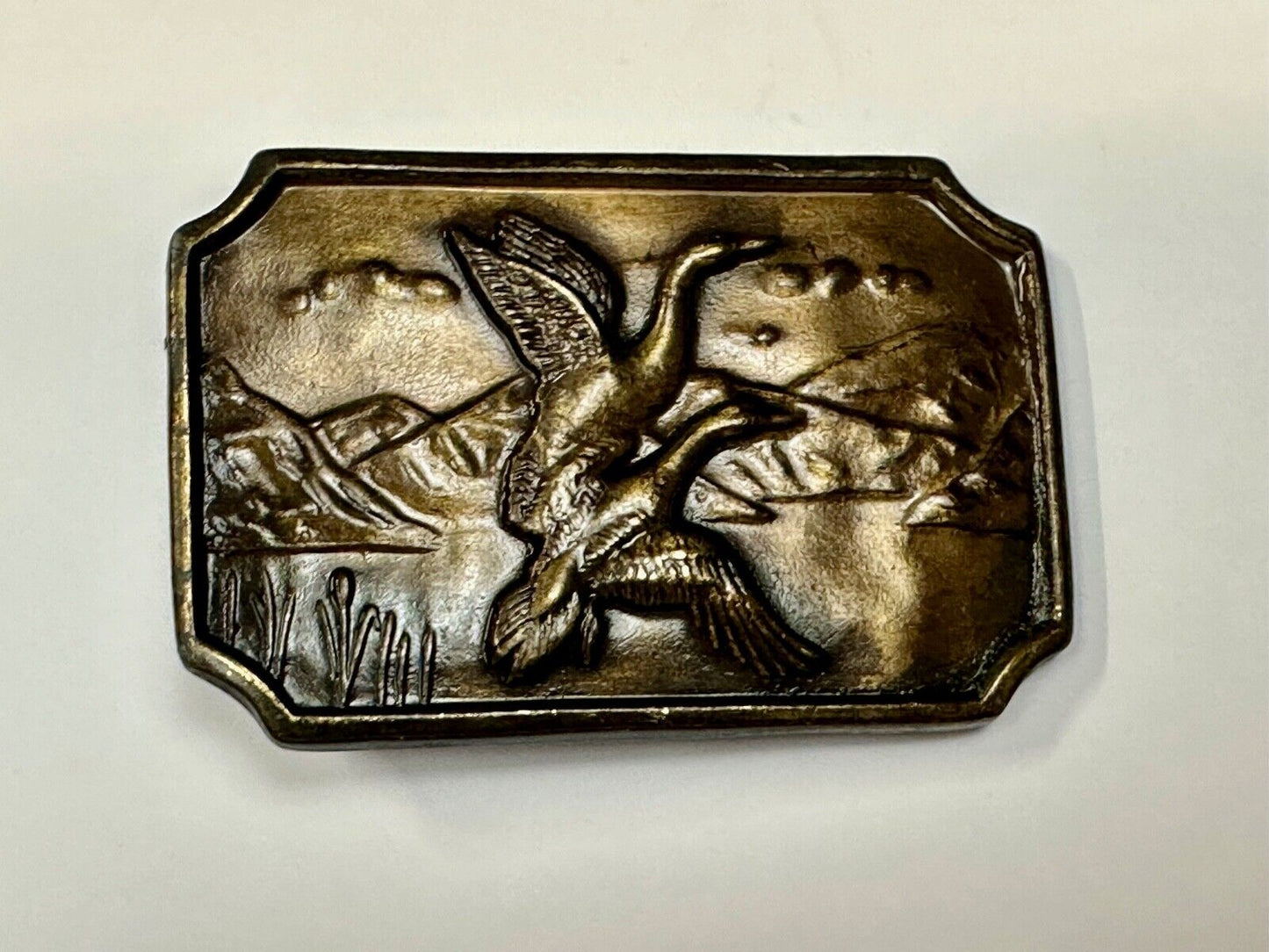 Two ducks flying from pond - Vintage nature scene belt buckle