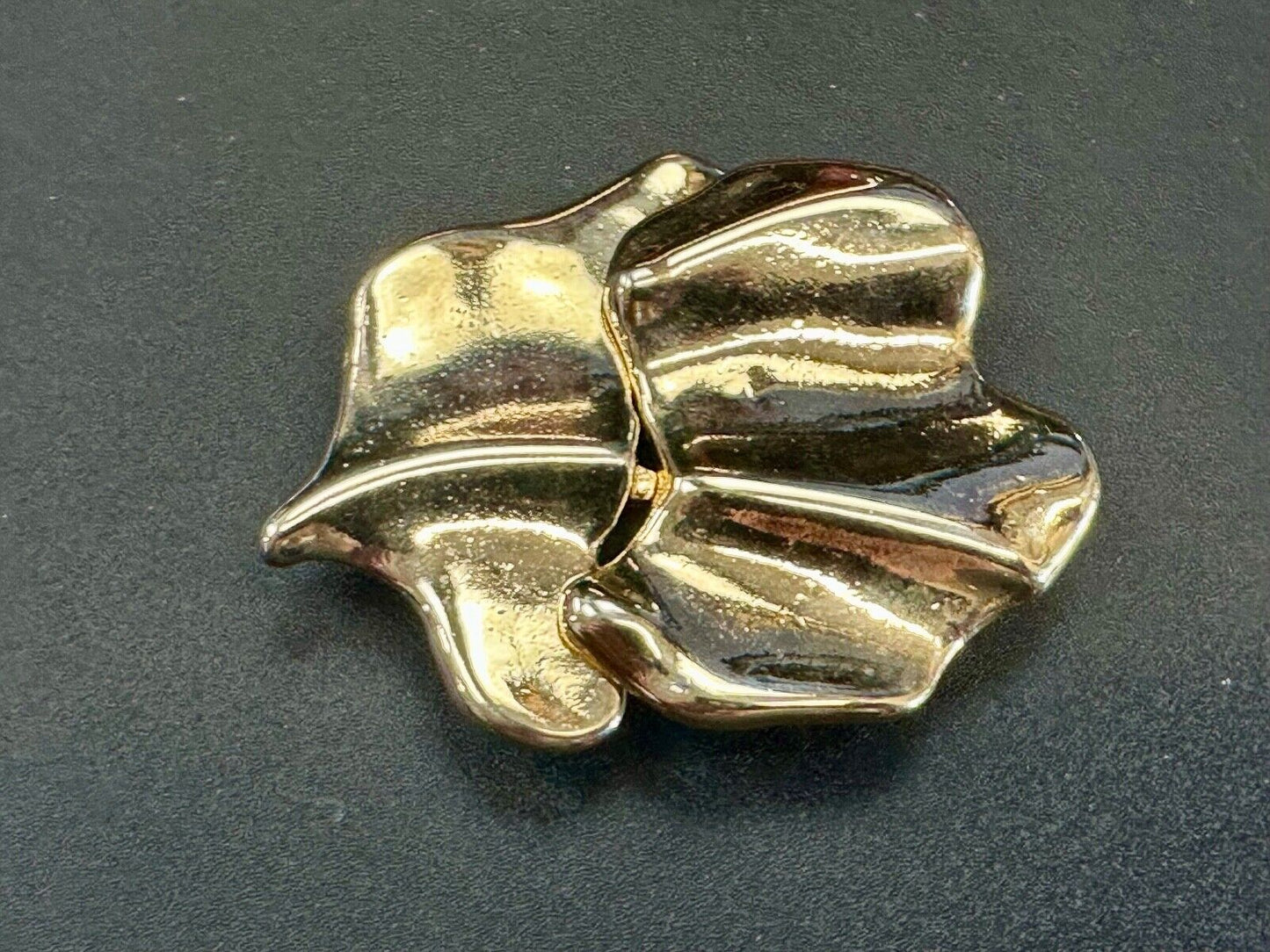 Two-piece interlocking gold tone leaf swirl theme belt slide buckle signed _____