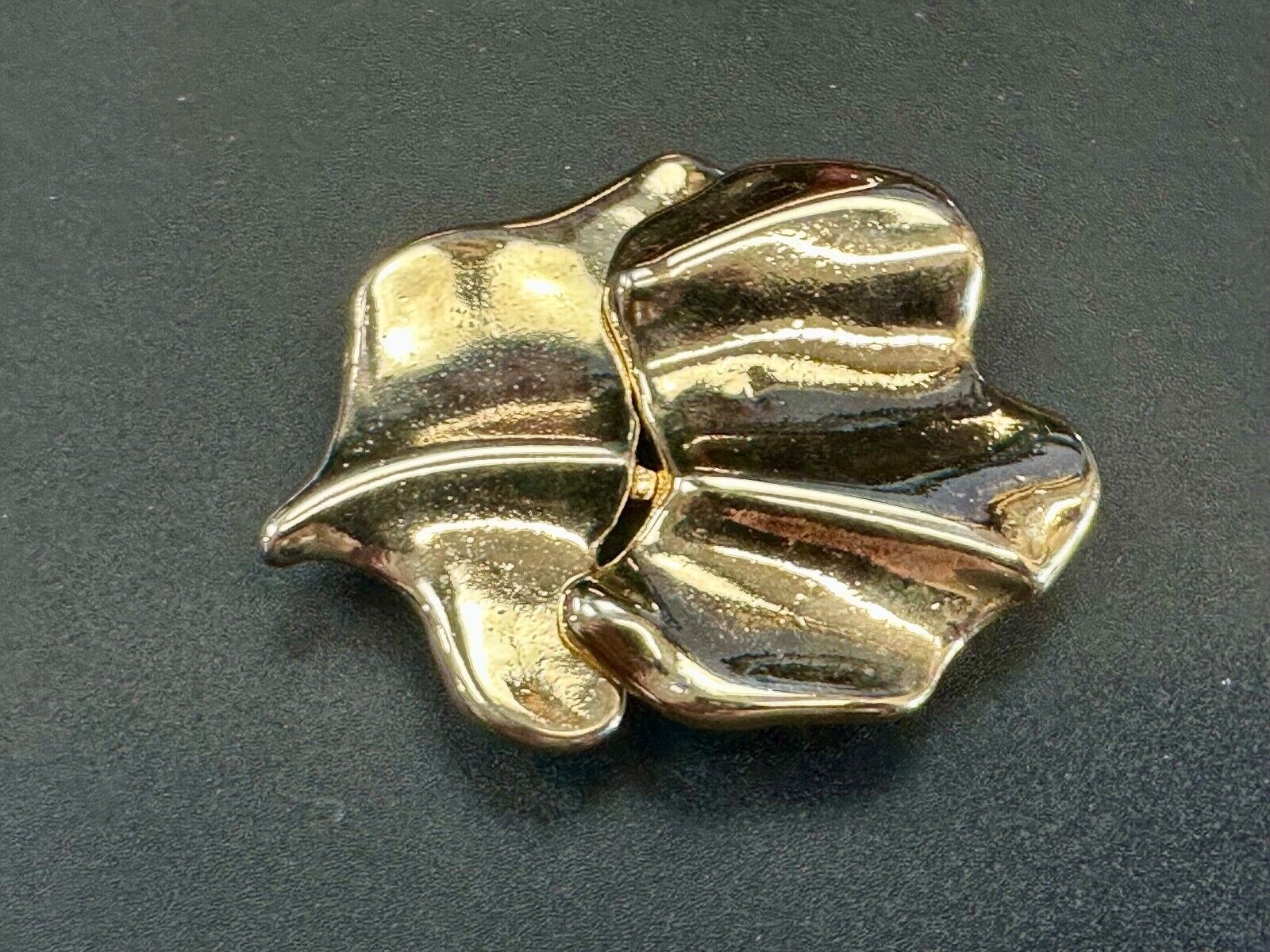 Two-piece interlocking gold tone leaf swirl theme belt slide buckle signed _____