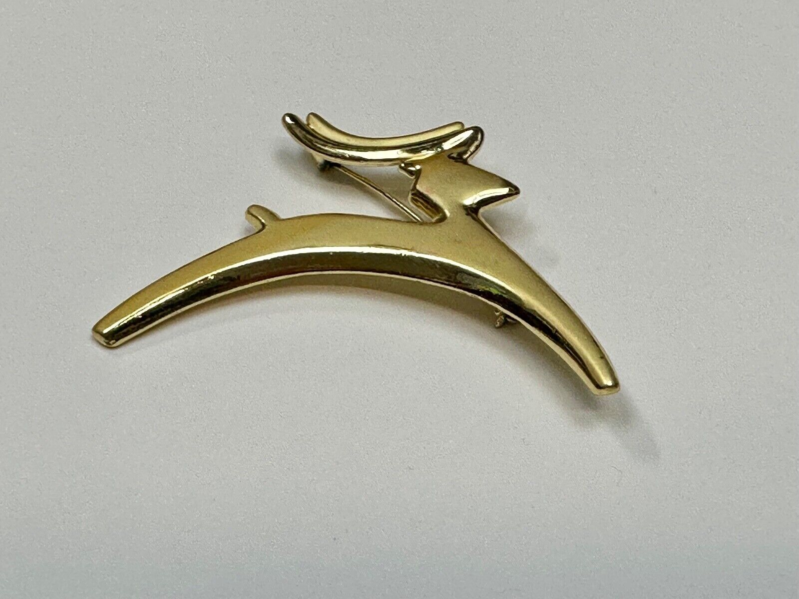 Abstract gold tone running deer - Vintage Christmas Holliday Brooch by AJC