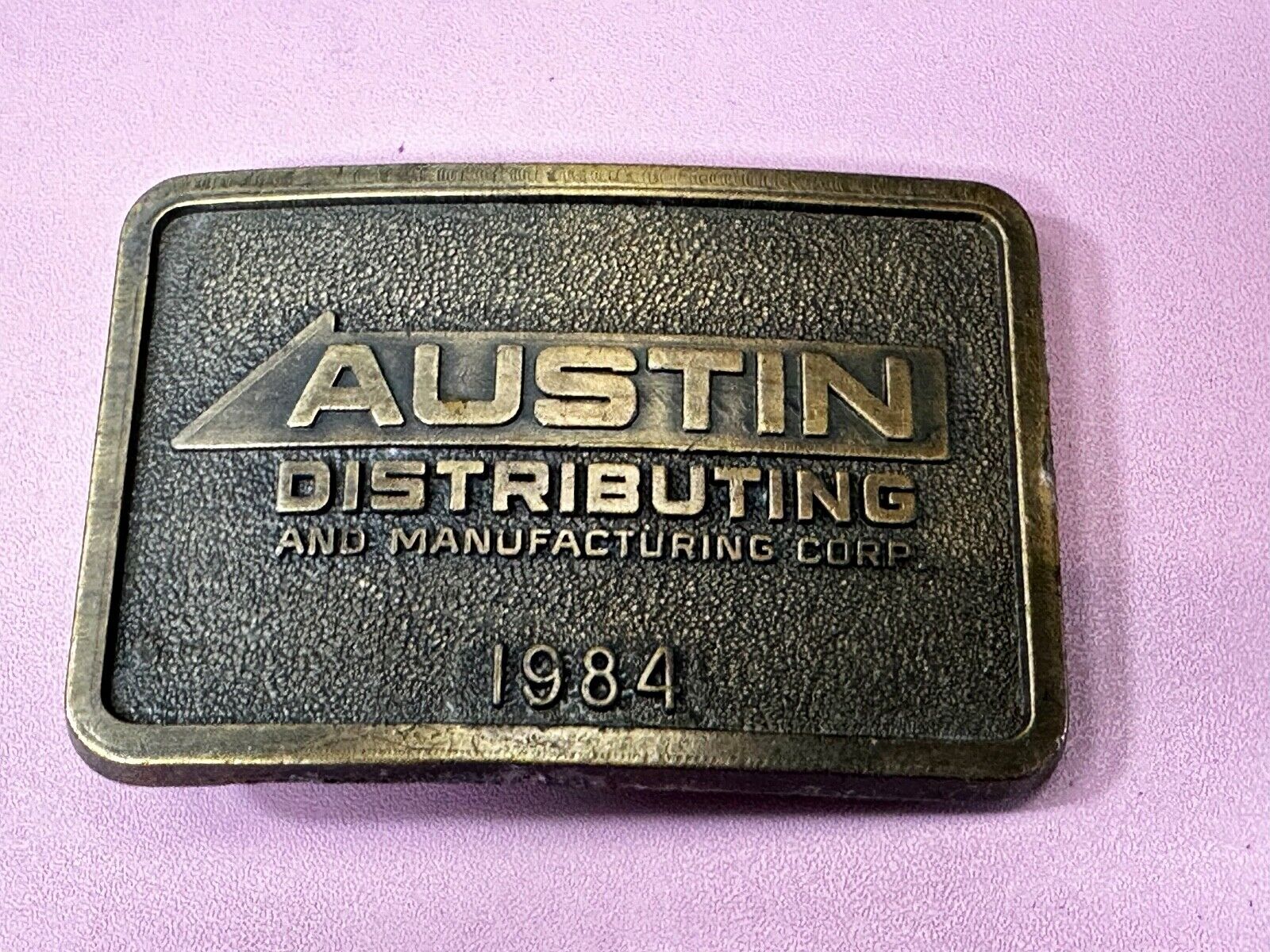 Austin Texas Distributing and Manufacturing 1984 Advertisement Promo Belt Buckle