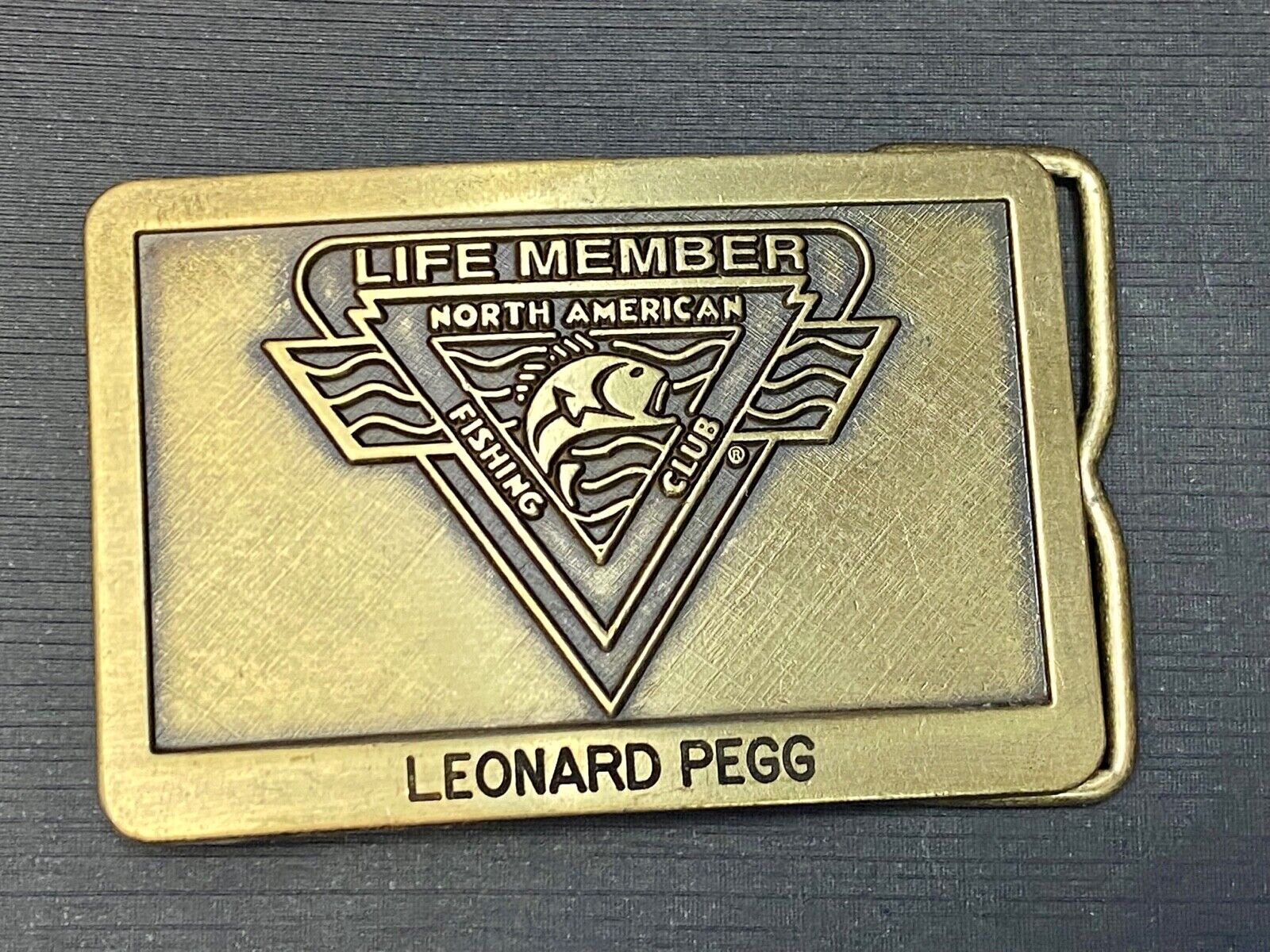Vintage Life Member of the North American Fishing Club brass tone belt buckle 